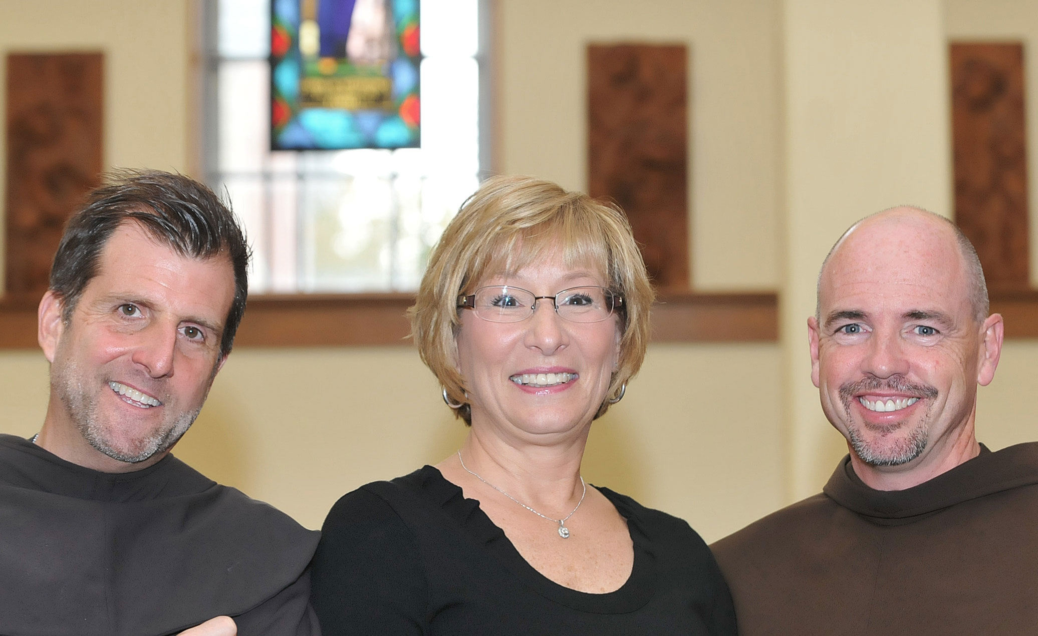 Left to Right: Mentoring Program Coordinator Fr. Sean O'Brien, O.F.M., Franciscan Center Director Judy Dougherty '06, College Chaplain Fr. Larry Anderson, O.F.M.