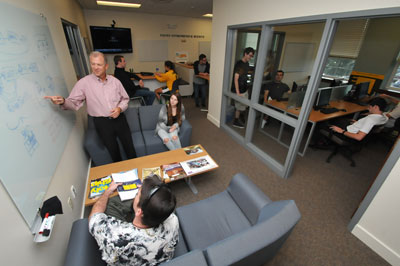 Stack Center Executive Director Mike Hickey '83 works with students in the new Stack Center for Innovation and Entrepreneurship.