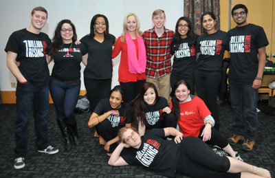 Student performers with One Billion Rising master of ceremonies Time Warner Cable News Anchor Kate Welshofer (center).
