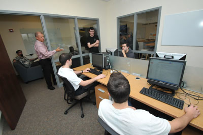 Executive Director Michael Hickey '83 works with students inside the Stack Center computer lab.